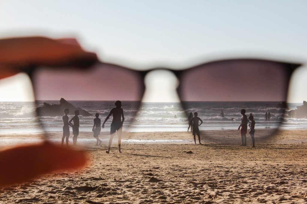 people on beach during sunset