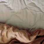 white and brown bed comforter