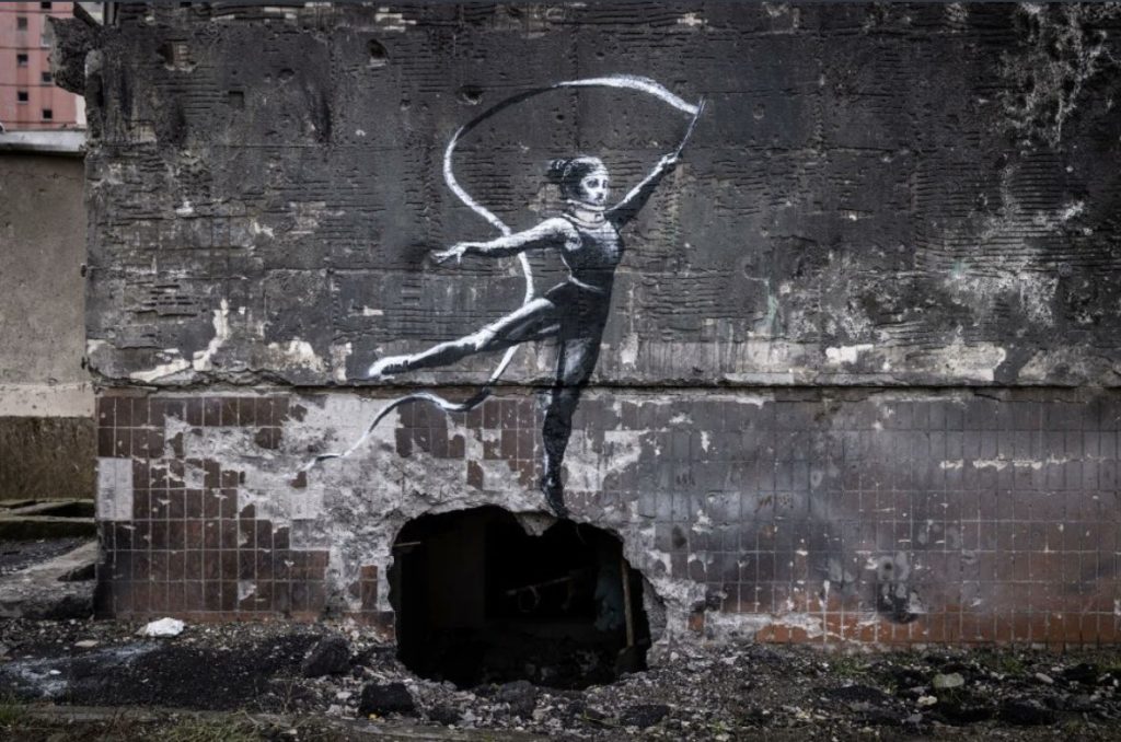 Banksy immeuble fille ruban danse