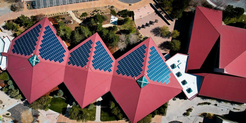 a group of buildings with red roofs
