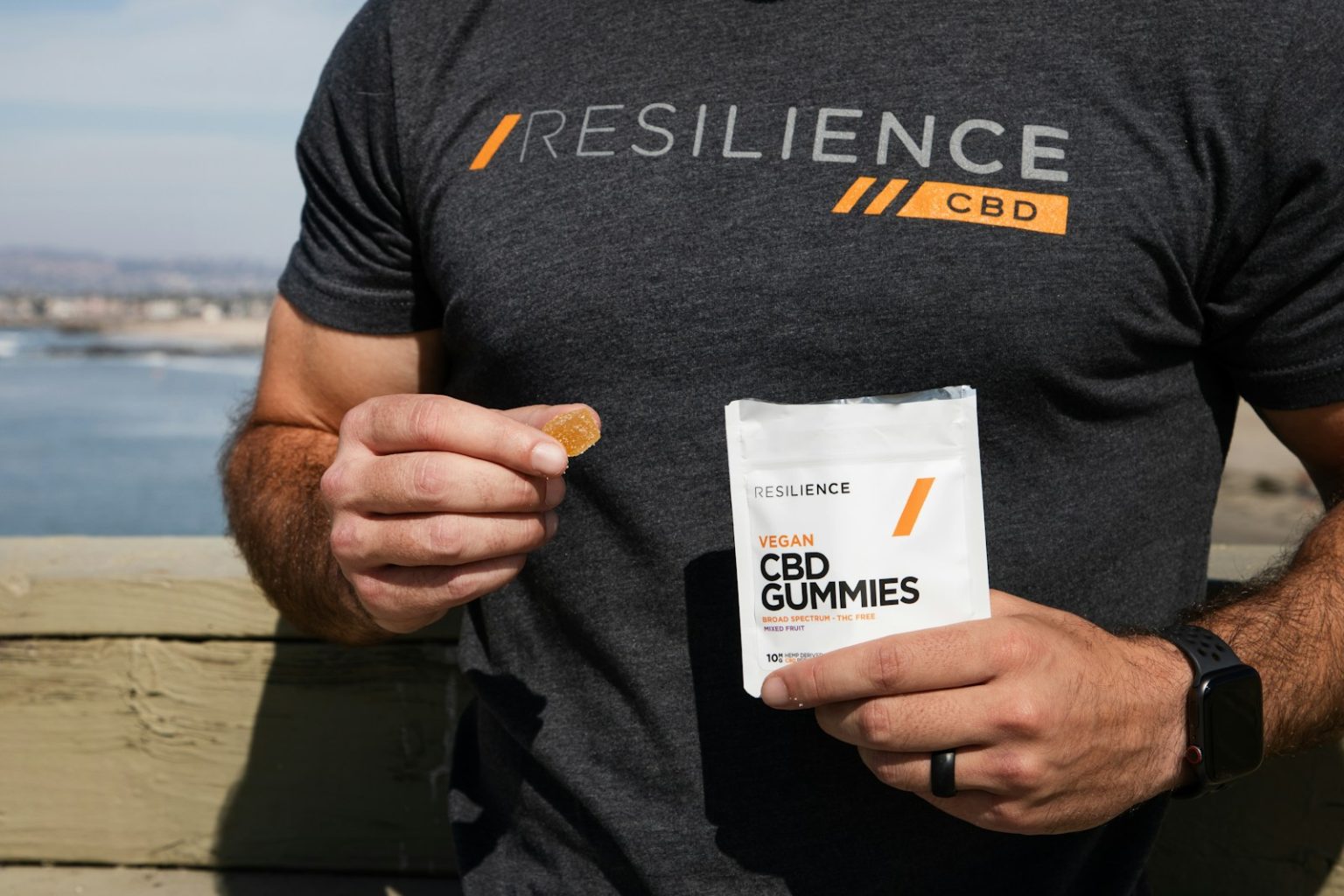 Le CBD : Découvrez Tous les Secrets de cet Allié Bien-être man in black crew neck t-shirt holding white plastic pack