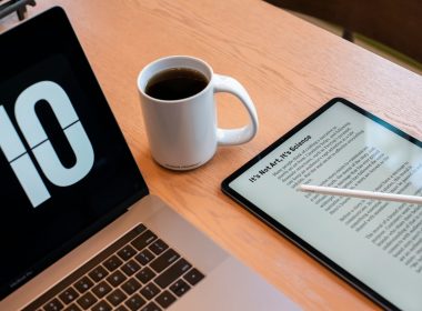 a tablet and a cup of coffee on a table